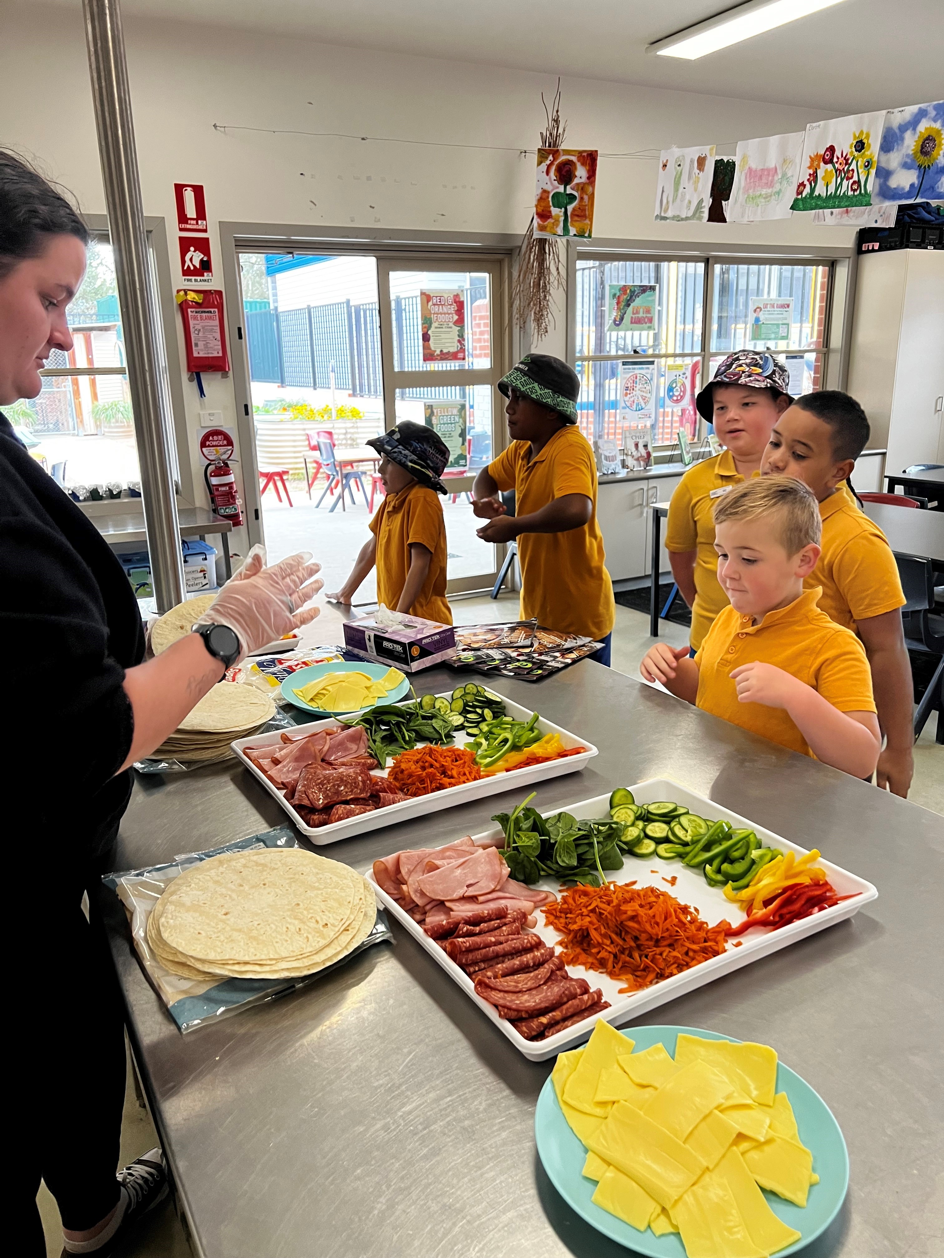 Photo for adult serving a range of healthy foods to children